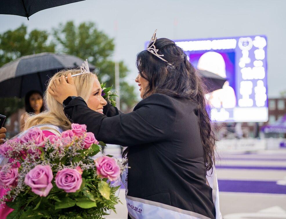  Gisselle Hernandez, last year's homecoming queen, passes the crown off to Walker.