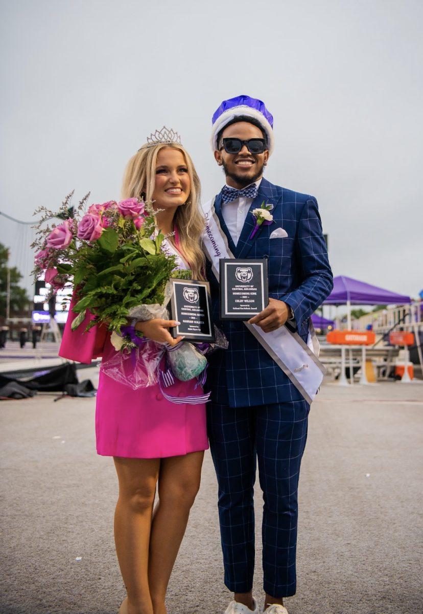 Seniors Hannah Walker and Colby Wilson lock arms after being named homecoming queen and king.