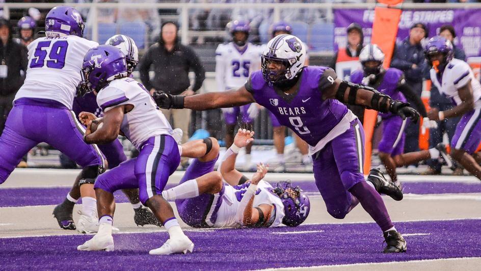 Junior defensive end David Walker moves to tackle a Tarleton State player. Walker was named United Athletic Conference's Defensive Player of the Week following the rainy day game.