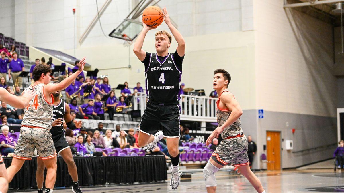 Sophomore guard Johannes Kirsipuu jumps for the shot. The Bears reigned victorious over the Warriors, winning the game 82-39. 