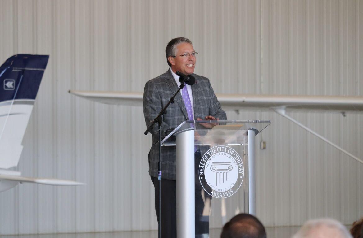 Brad Teague, UCA athletic director and interim director of the UCA Aviation Academy, speaks about the new program at the Conway Municipal Airport, Nov. 15. UCA will begin training pilots next March.