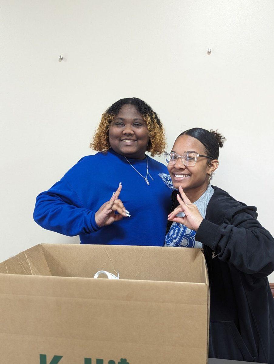 Members of the Zeta Phi Beta sorority collect donations at the Ronnie Williams Student Center. The clothing drive aimed to help the homeless population.