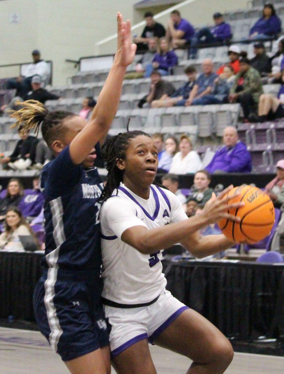 Junior guard Randrea Wright defends her possession with an opponent behind her. The Sugar Bears will return to the court Feb. 8 to play against Florida Gulf Coast University in Fort Myers, Florida.
