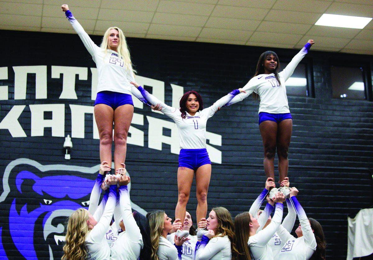 (Left) Junior flyer/tumbler Bailey Dougherty,(center) junior flyer/tumbler Crystal Vuong and (right) sophomore flyer/tumbler Sajala Bell stand high in the air as their teammates hold them up. STUNT now gives UCA female students 10 sports to play.