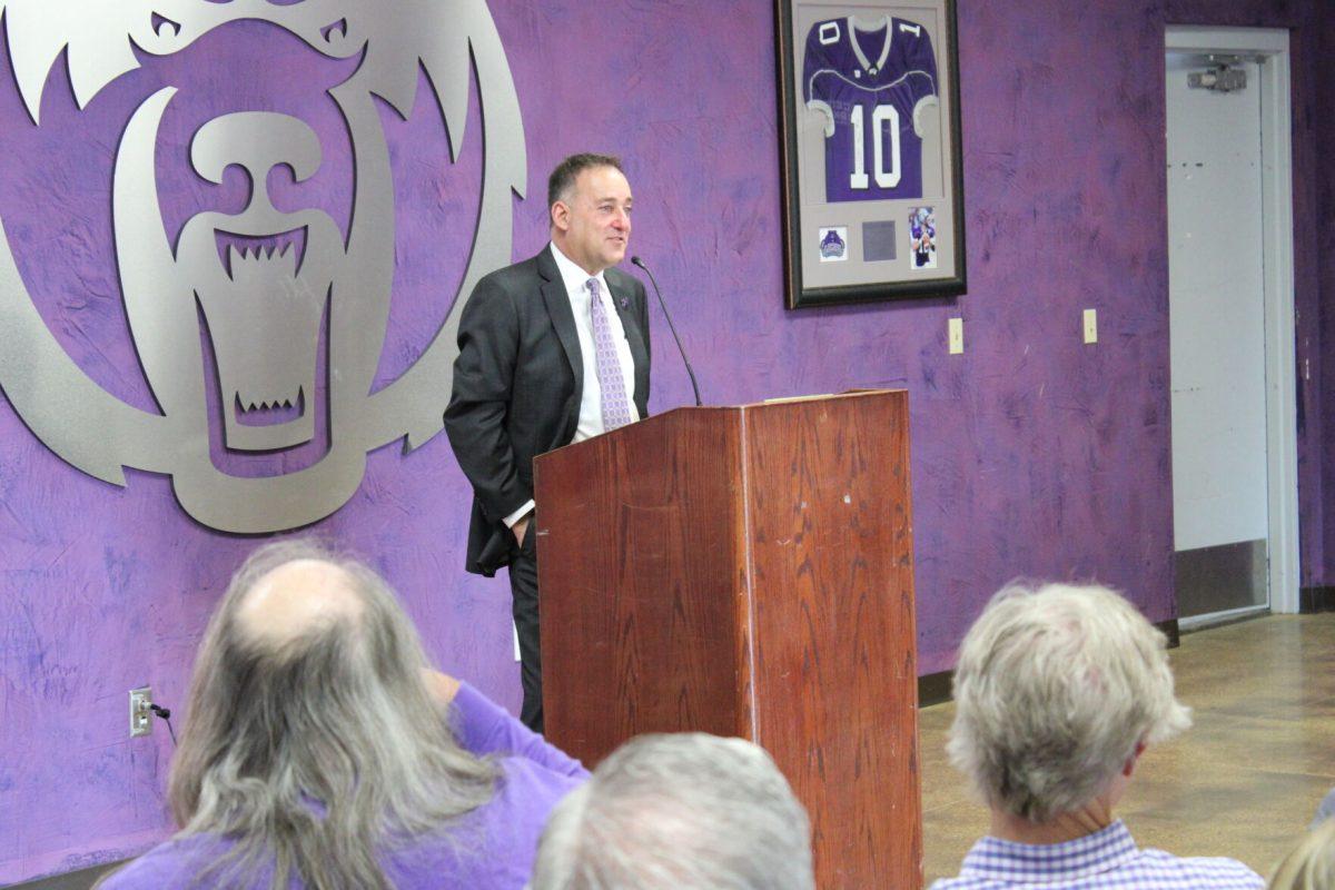 John Shulman, the new men's basketball coach, speaks at a news conference in the Estes Stadium Hall of Fame Room. Shulman was hired after the Athletic Department fired previous coach Anthony Boone