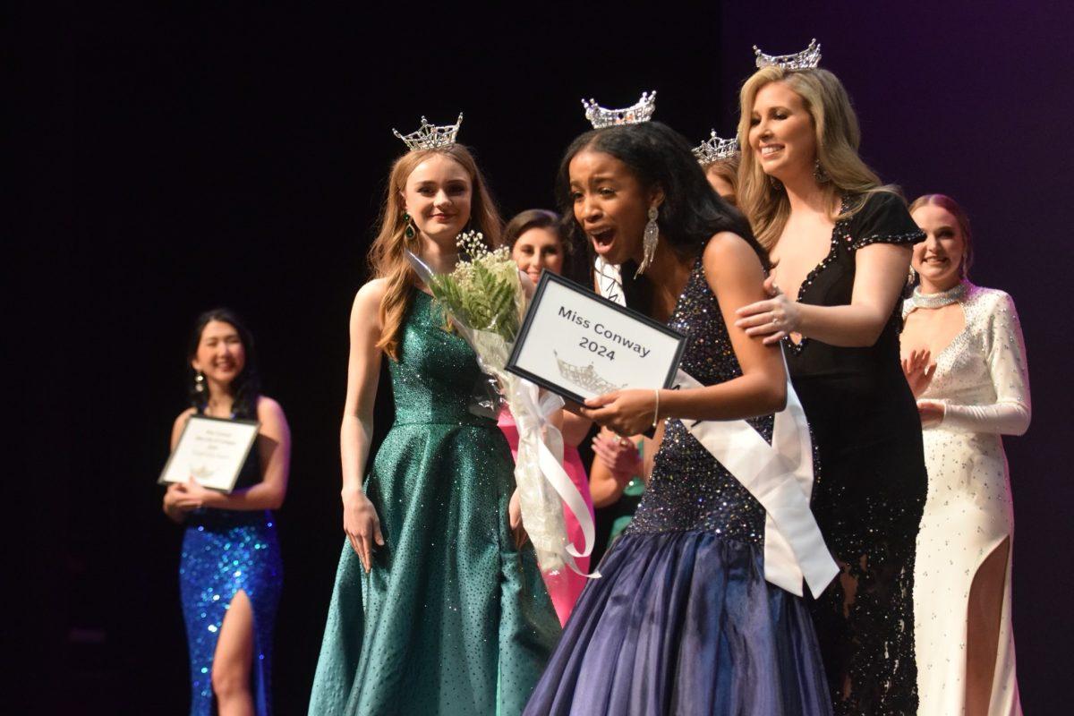 Ana Brandon is crowned Miss Conway by Mattison Gafner. 