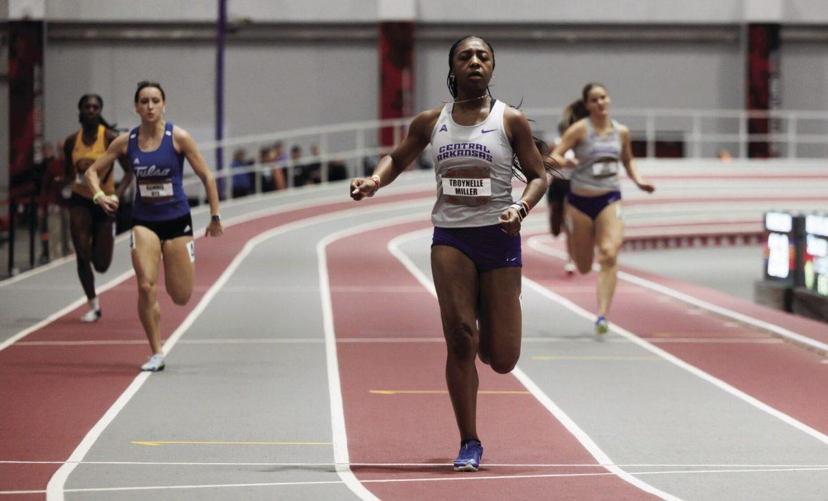 Freshman Troynelle Miller rushes past her competition in the Randal Tyson Track Center. Miller’s indoor personal bests include a time of 7.56 in the 60-meter dash and a time of 25.13 in the 200-meter dash.