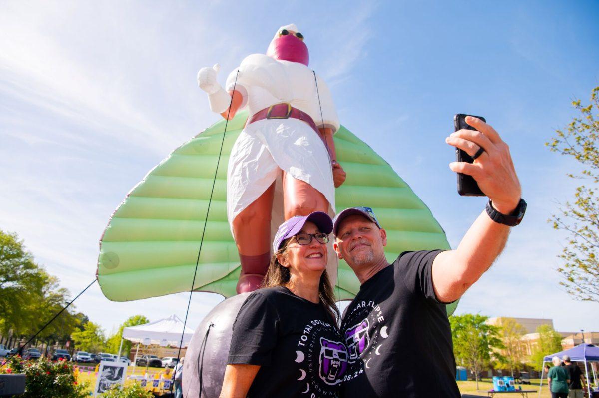Sociology professor Edward Powers and his wife Kathy Powers take a selfie in front of LUNA. NASA’s Arkansas Space Grant Consortium and the Arkansas Art Council helped fund the inflatable’s creation.