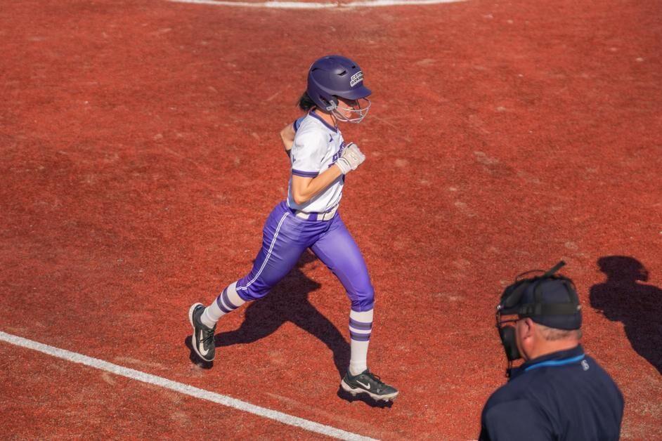Junior infielder Kylie Griffin jogs to the home plate. Griffin has hit the ball 45 times this season and has started in every game.