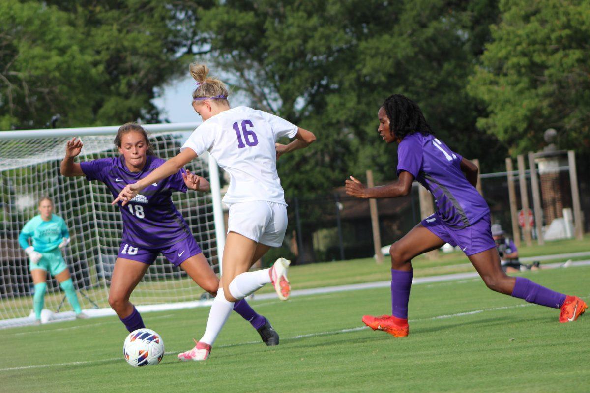 Junior forward/midfielder Ashlanne Fuentes blocks sophomore forward Abbi Armstrong from making a pass. 