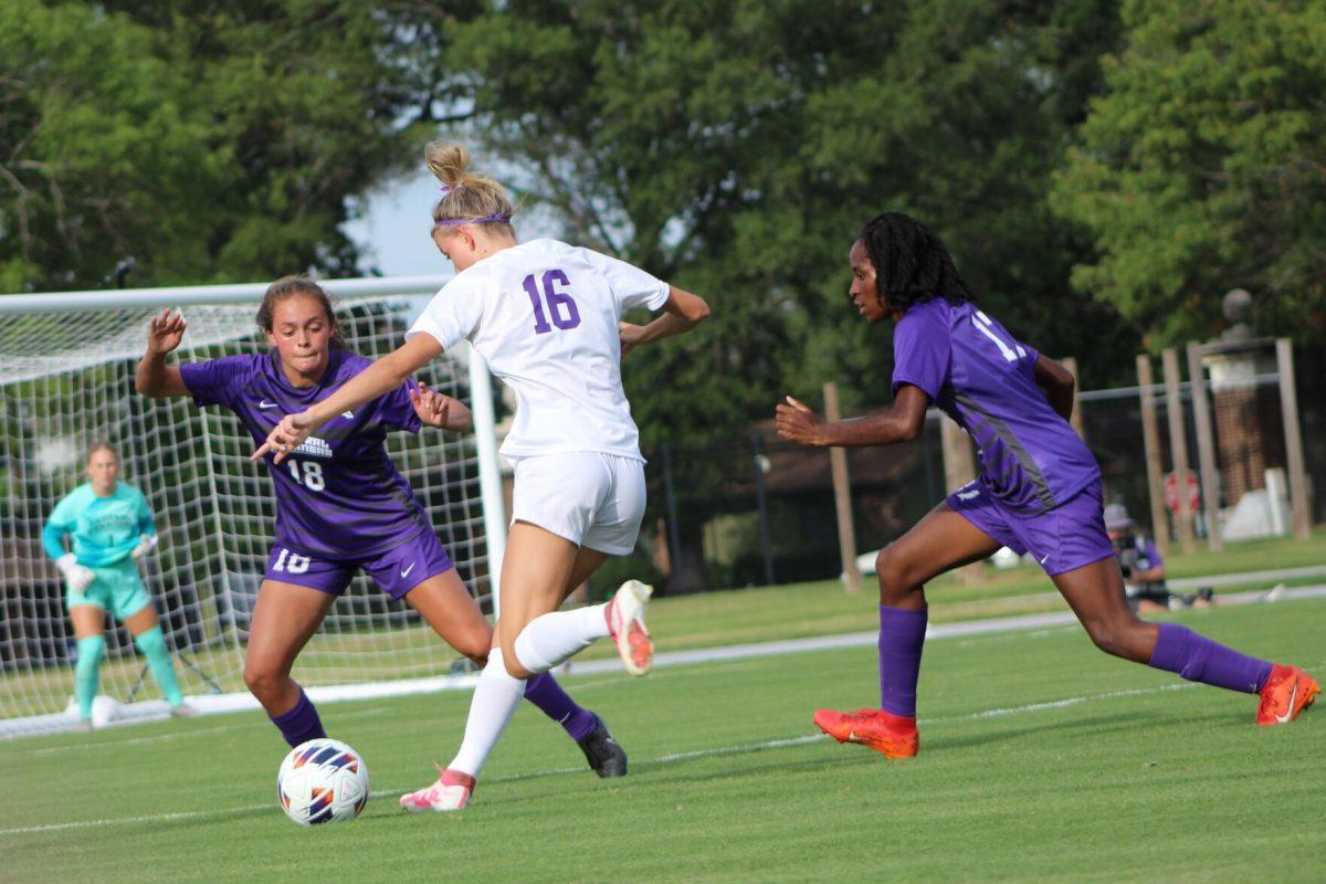 Junior forward/midfielder Ashlanne Fuentes blocks sophomore forward Abbi Armstrong from making a pass. 