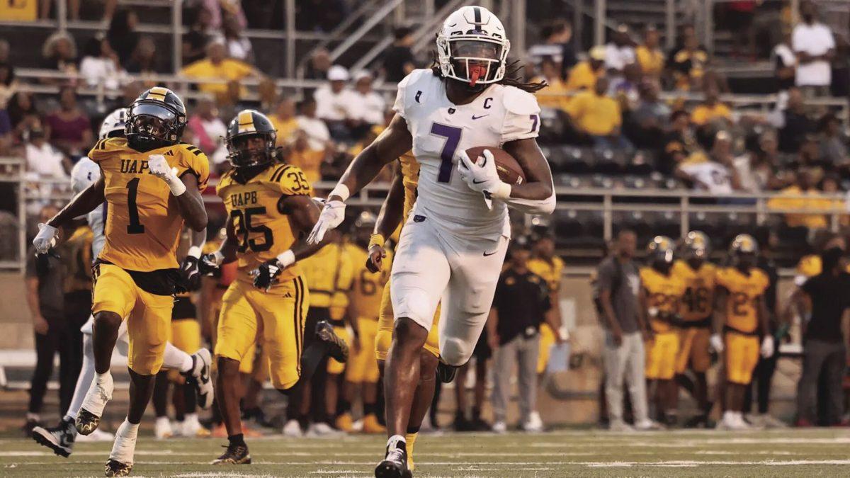 Senior defensive back TaMuarion Wilson runs with the football after getting an interception. This was the only interception UCA received in the game against Pine Bluff.