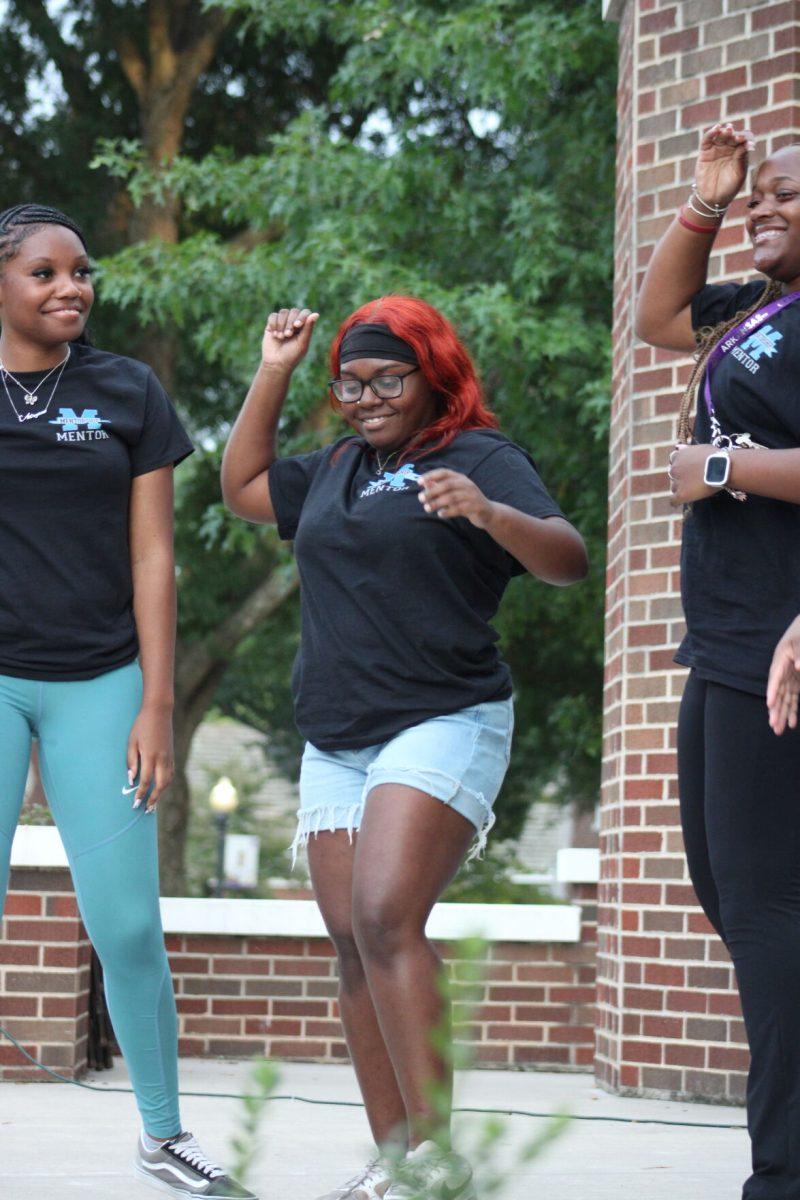 Mentors dance during Mentors on the Yard. 