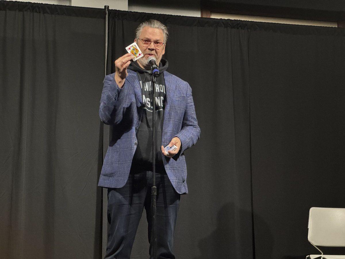 Magician and comedian Derek Hughes shows card tricks to students in the Ronnie Williams Student Center ballroom. Hughes visited UCA on Sept. 11 to share his love for magic and stand-up comedy.