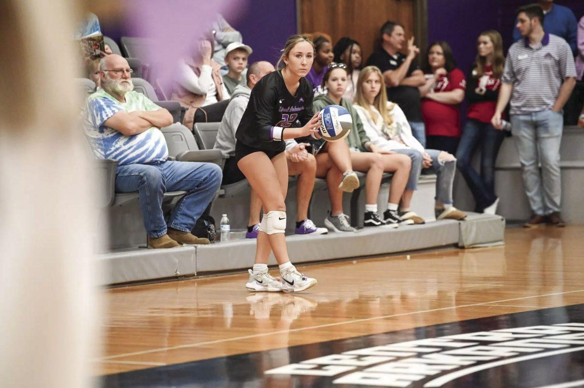 Junior defensive specialist/libero Alexis McDaniel holds the ball, preparing for the next play. McDanial had eight digs in the loss against Alabama (photo courtesy of ucasports.com)