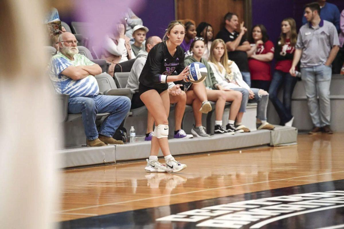 Junior defensive specialist/libero Alexis McDaniel holds the ball, preparing for the next play. McDanial had eight digs in the loss against Alabama 
(photo courtesy of ucasports.com)