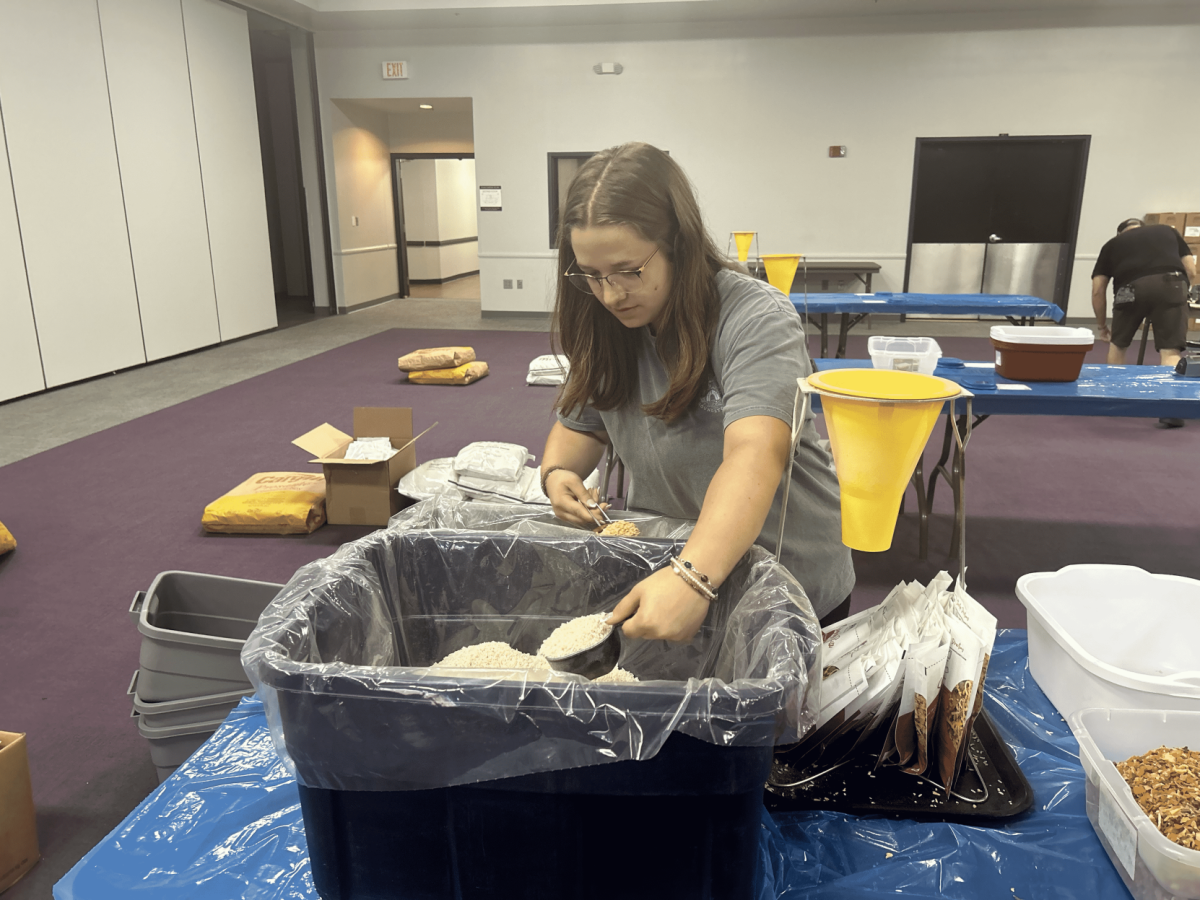 Student packs blessing bag during X-period. Blessing bags are intended to combat food insecurity. 