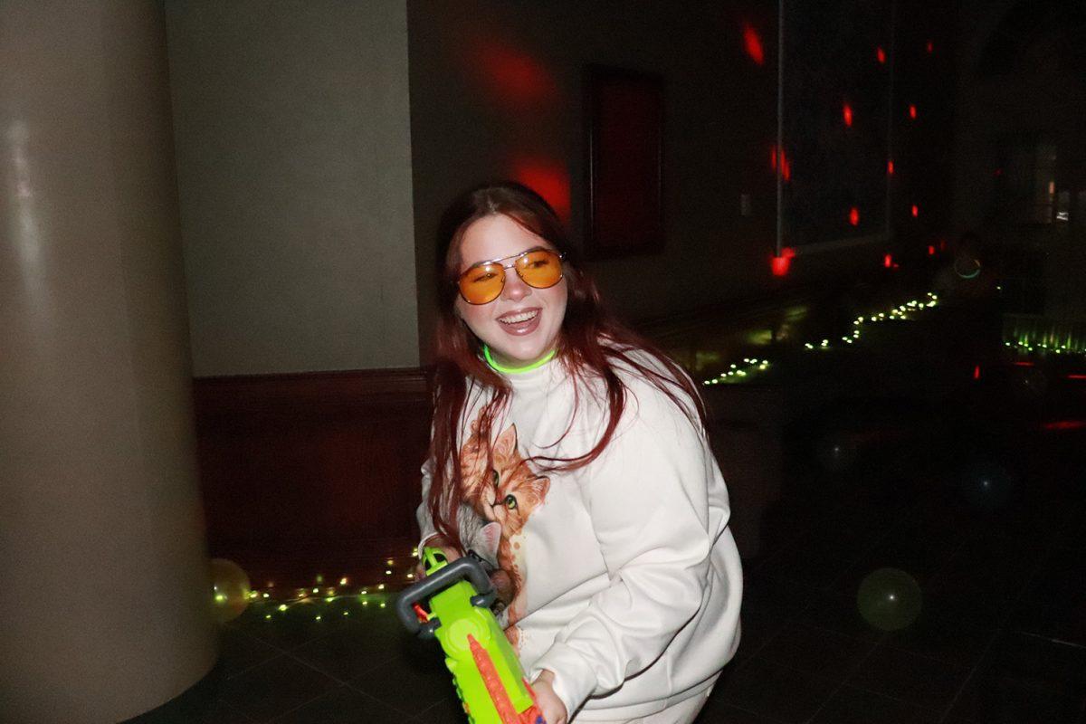 Social Media Content Manager Chloe Hudspeth participates in the first Nerf war at Thompson Hall. The Nerf War was the final event for Communication Week. 
