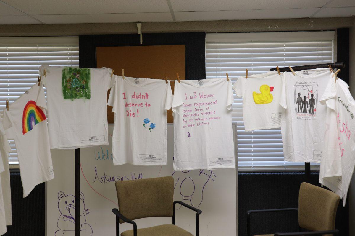 White T-shirts representing victims who have died from domestic violence are strung from a clothesline. The Clothesline Project, which was in Arkansas Hall from Oct. 29 to Oct. 30, provided family members with shirts to decorate in commemoration of victims. 