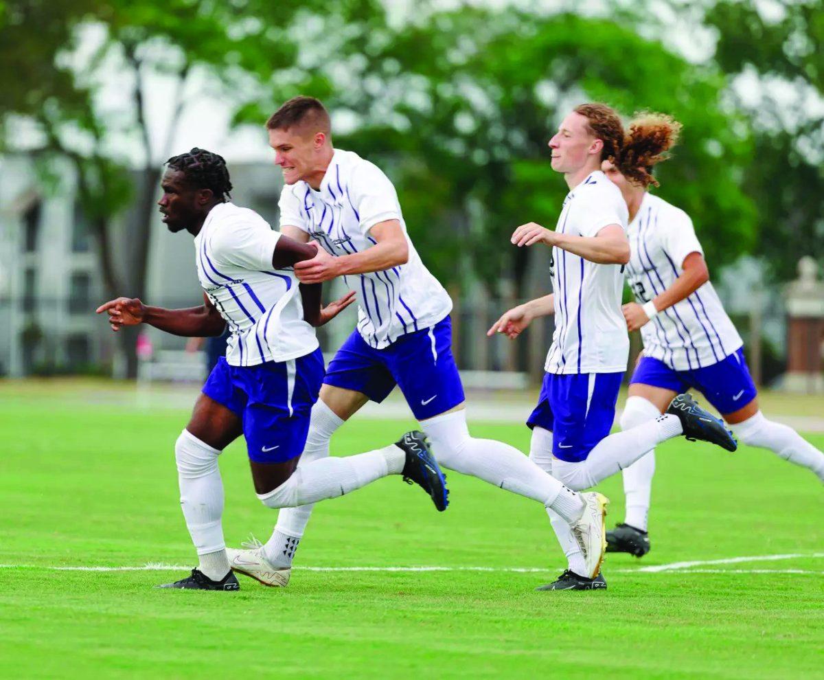 A group of UCA soccer players hustling toward the ball. The matchup against North Florida was the highest scoring outing for the Bears all seasonlong.