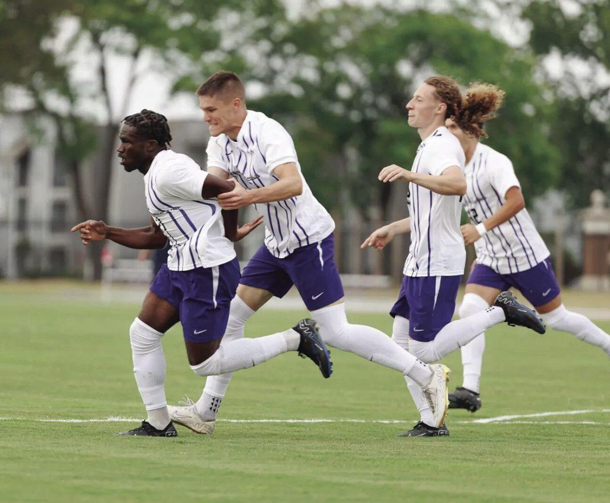 A group of UCA soccer players hustling toward the ball. The matchup against North Florida was the highest scoring outing for the Bears all season
long.
