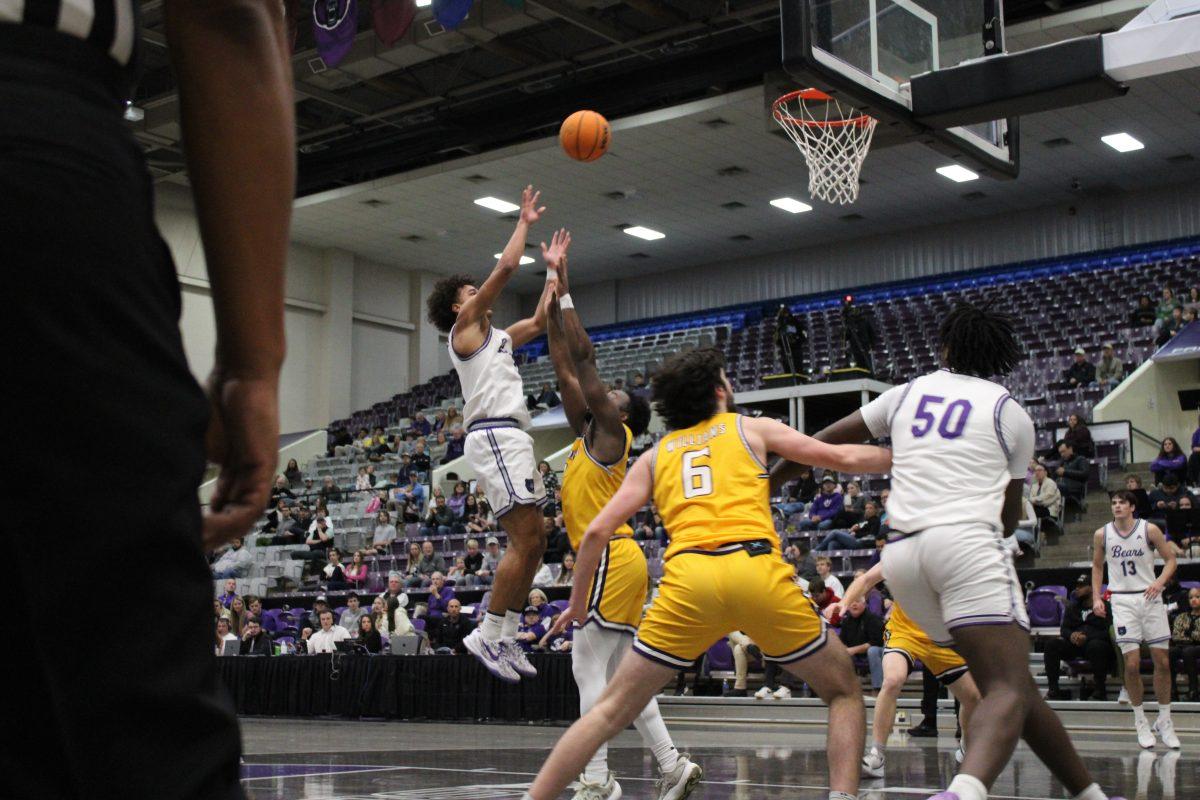 Sophomore guard Brayden Fagbemi attempts to shoot the ball into the net against the Lipscomb University Bisons on Jan. 25 at the Farris Center. Fagbemi has scored 89 points for the Bears this season.