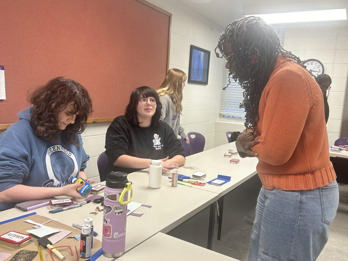 Students using different crafting materials to make first aid kits. Pictured on the right of the screen is Riva
Brown, associate professor of public relations and acedmic coordinator for Baridon Hall.