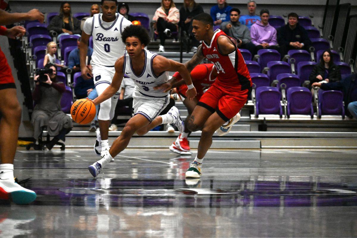 Sophomore guard Brayden Fagbemi weaves around Austin Peay junior guard Hansel Enmanuel. Fagbemi scored 13 points and set a career high of 10 assists against the Governors. 