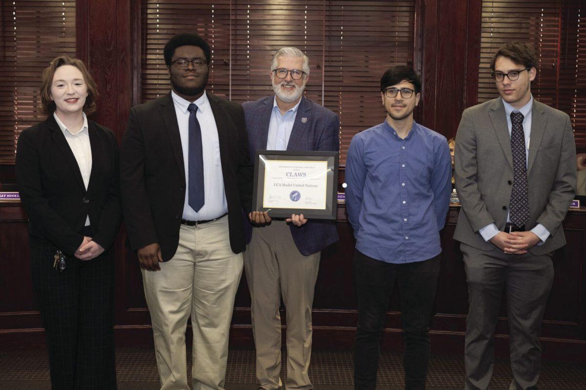 Members of Model UN with UCA President Houston Davis. Model UN was awarded the CLAWS award in Dec. 2024. 