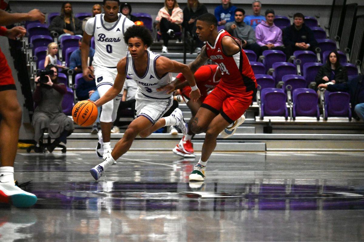 Sophomore guard Brayden Fagbemi weaves around Austin Peay junior guard Hansel Enmanuel. Fagbemi scored 13 points and set a career high of 10 assists against the Governors. 