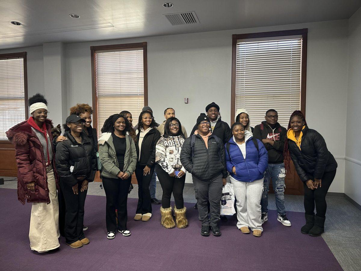 A group of students pose for a picture after the MLK march. 