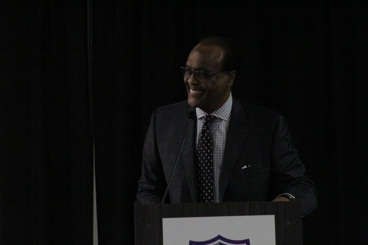 Ronnie Williams speaks at the front podium. Williams was the event's keynote speaker. 