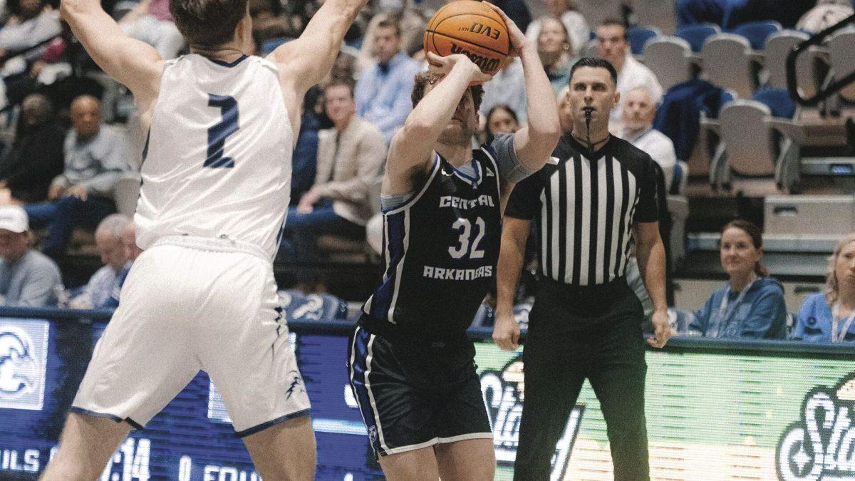 Freshman guard Layne Taylor attempts to shoot a 3-pointer in the Bears’ 92-80 loss against North Florida. Taylor scored 19 points against the Ospreys.