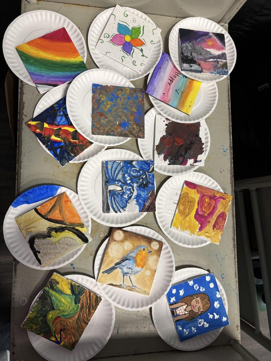 Tiny masterpieces painted by local participants for library's art show.