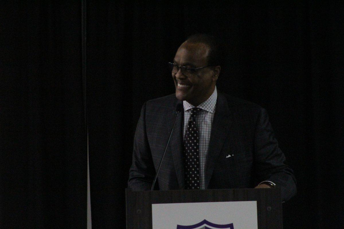 Ronnie Williams speaks at the front podium. Williams was the event's keynote speaker. 