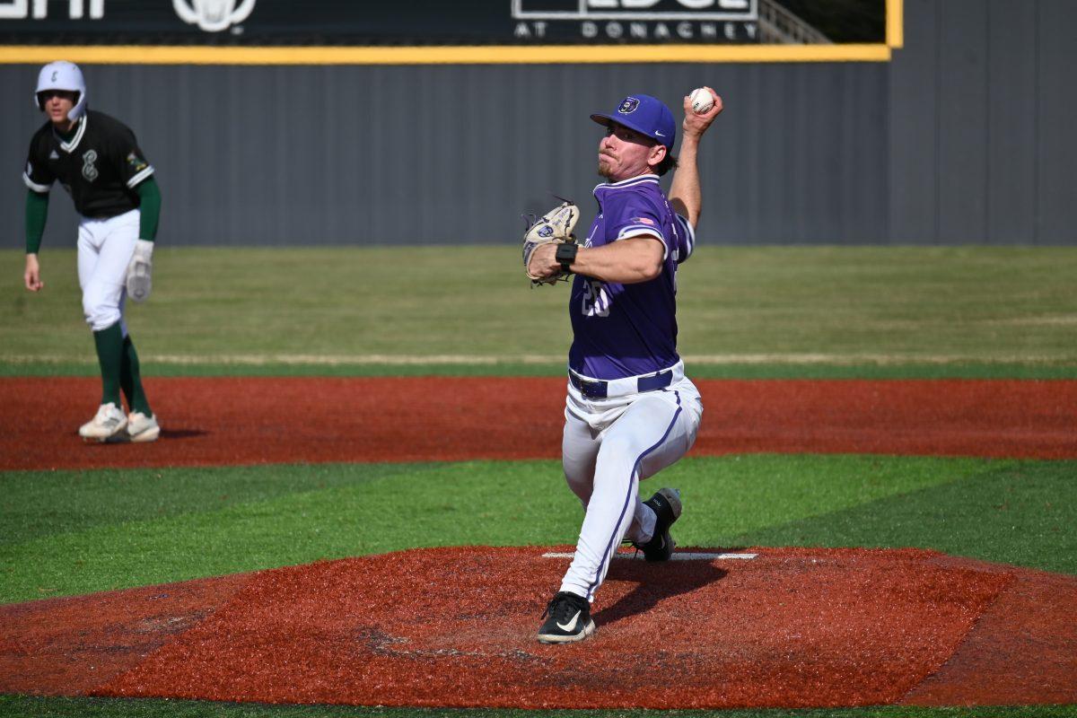 Senior right-handed pitcher Perry Titlow pitches in the fifth inning for the Bears. Titlow has thrown four strikeouts in three games this season.(photo by Meredith Lipsey)