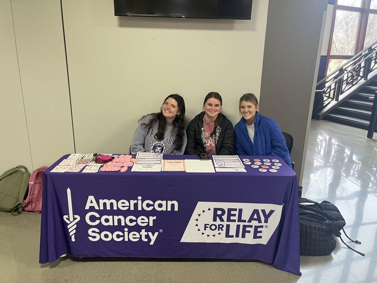 (Left) Alaina Dupas, (middle) Camden Gibson, (right) Kate Hale pose for a picture in front of their table. The next Relay For Life event at UCA will be Feb. 20 at Don Pepe's. 