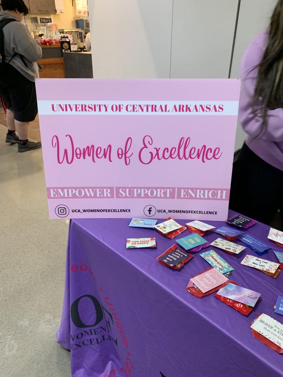 Standing together to empower women, the Women of Excellence organization handed out words of affirmation alongside candy to uplift women across campus Jan. 28 in the Ronnie Williams Student Center. The tabling event focused on handing out positive affirmations to women in need of uplifting. WOE’s initiative is to enhance the collegiate experience for women on the UCA campus. The group encourages women of color to address and overcome issues with self-esteem, achieving academic goals and having an overall enriching college experience. The president, vice president and treasurer of WOE decorated the table, handed out sweets and spread the group’s message of inclusion and positivity. Warm smiles, inspiring conversations, and an enriching sense of community were also provided at the event. Senior and WOE President Kiana Wright said the event's goal was to “give affirmations to the young women that come by and just allow them to know that Women of Excellence are here for you and we're not just here to put on programs or events. We’re here to be here for you and just help you get through this semester.”Wright said she gives credit to the organization’s warm environment and enticing message for encouraging her to join the group. Wright said, “I initially joined my freshman year and just seeing the way that they pulled me in as a freshman and gave me resources and guidance as a freshman.” Wright also mentioned the immense support she experienced while being a part of WOE. Wright said, “The love they poured out to me as soon as I stepped foot onto campus” truly enhanced her UCA experience. WOE and its members are committed to being there for women throughout the semester.“We need women to uplift each other and keep each other uplifted while we feel like there’s a lot going on in this world. So just knowing that you have women in your circle that want to see you succeed and love you, and just being a good asset to the college is important,” Wright said.Junior and WOE Vice President Aariah Strickland also attributes the collection of women to creating a safe, welcoming and relaxing environment. Strickland said, “I’ve been a part of this group since 2023 and I’ve seen our group come together and demonstrate our ladies empowering women and making them feel comfortable.” 