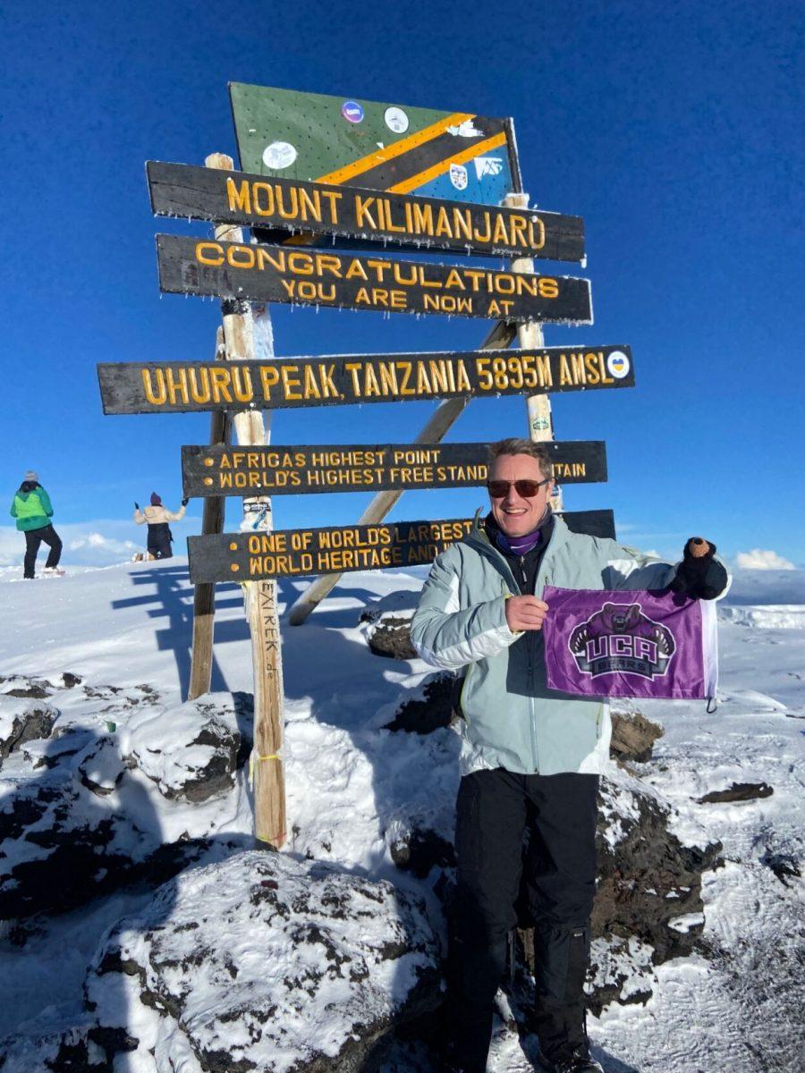Robert Norvell stands atop Mount Kilimanjaro holding up a UCA
flag. Norvell spent a total of seven days hiking the mountain.