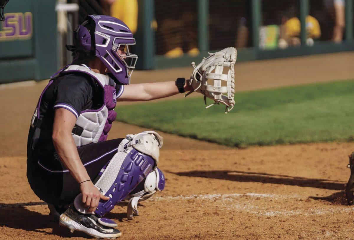 Junior catcher Autumn Vessier prepares to catch a pitch. Vessier had five putouts against the Tigers.