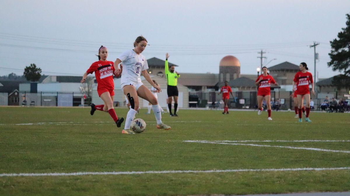 Freshman forward Kayla Hurley kicks the ball down the field against the Blizzards. Hurley scored 3 goals in the fall of her debut season with the Bears. 