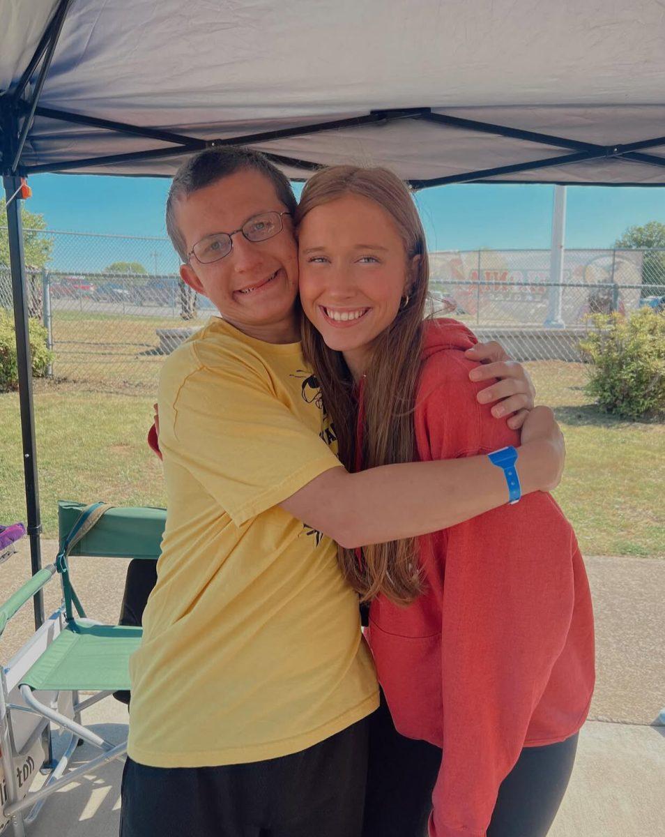 Junior Lauren Beene shares a hug with a friend.