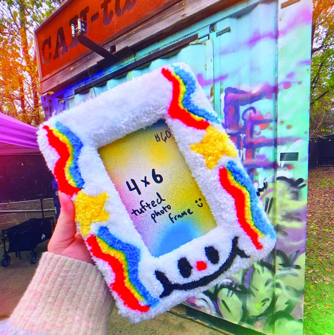 Artist TaylorAnn O'Brien displayed her tufted photo frame. Her color and pattern techniques shine through in her art.
