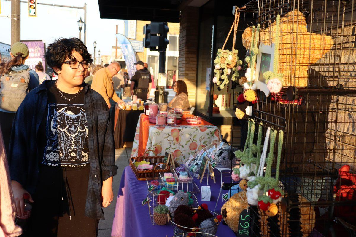 Alex Denney roamed around the Art Walk. Denney seen enjoying the atmosphere.(photo by Mary Lyle)