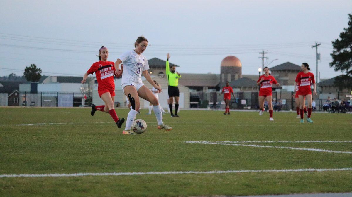 Freshman forward Kayla Hurley kicks the ball down the field against the Blizzards. Hurley scored 3 goals in the fall of her debut season with the Bears. 