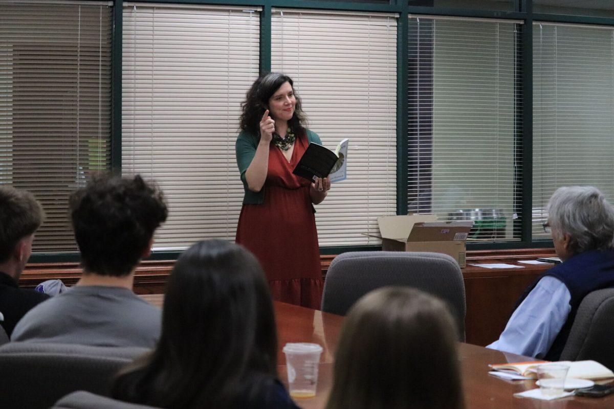 Poet Katie Hartsock recites poetry in Win Thompson Hall. Hartsock also
discussed her book “Wolf Trees.”
