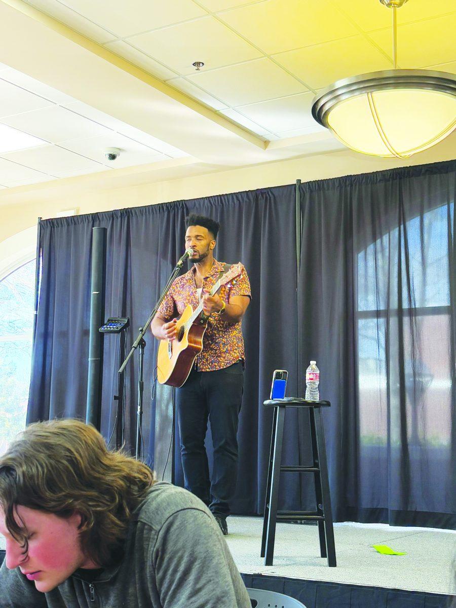 Singer Phillip-Michael Scales sings in the student center.