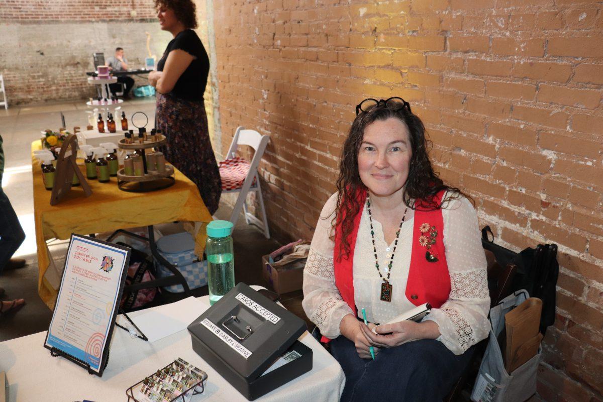 Artist Janetta Darley poses for picture. She displayed her pieces at the fest.