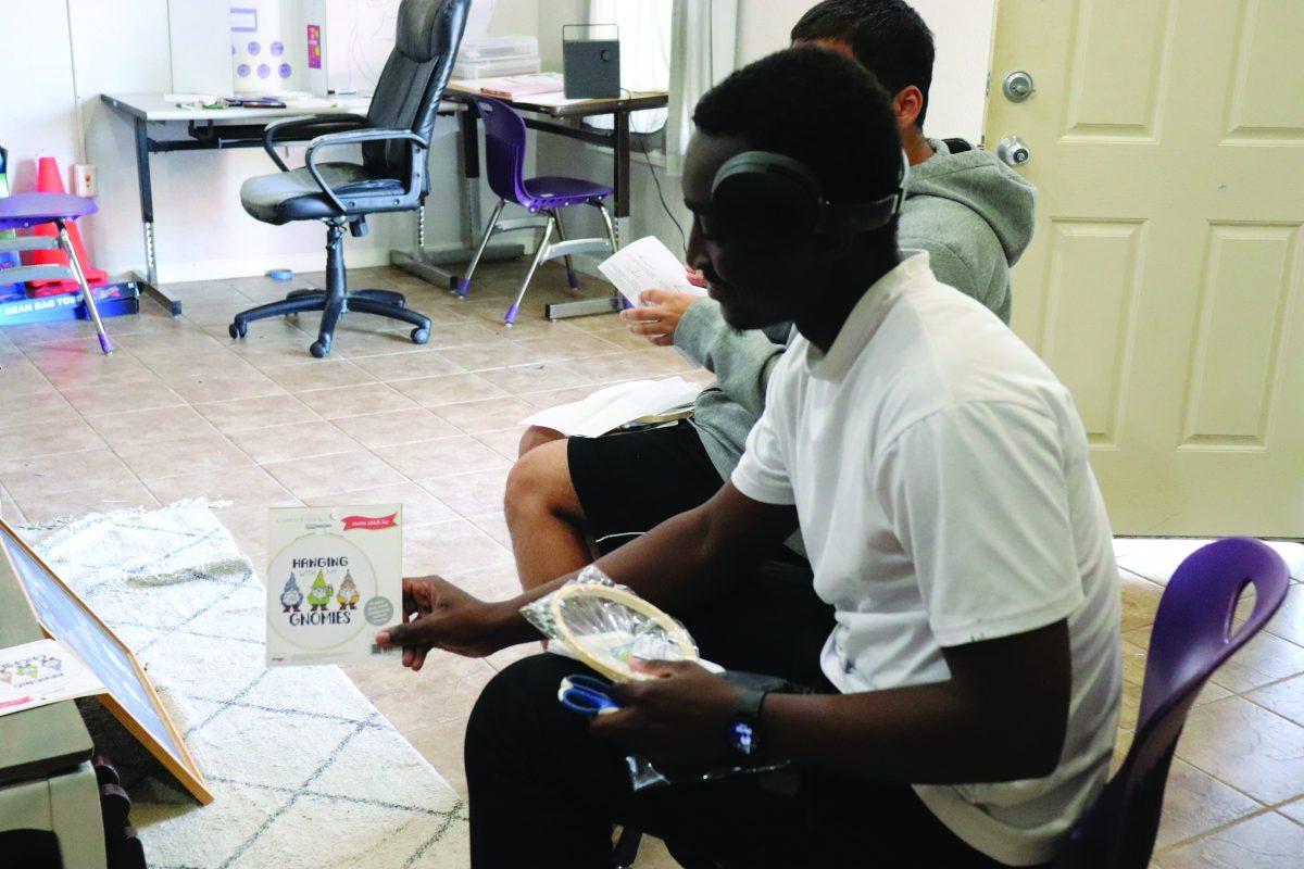 Samuel N’Guessan crafts with an embroidery circle.