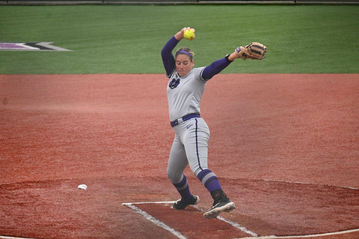 Senior pitcher Bailie Runner throws a drop ball pitch at the top of the first inning against EKU. Runner had a season high of seven strikeouts on Sunday.